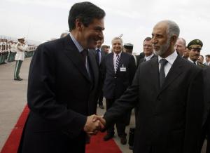 Algeria's prime minister Abdelaziz Belkhadem (R) shakes hands with