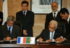 Algerian Defense Minister Abdelmalek Guenaizia (2nd R) and his