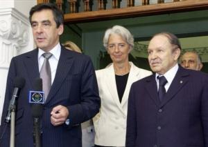French Prime Minister Francois Fillon, left, flanked by Finance
