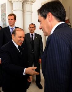 Algerian President Abdelazziz Bouteflika (L) welcomes French Prime Minister