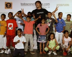 Oscar-winning Spanish actor Javier Bardem poses with Sahrawi children