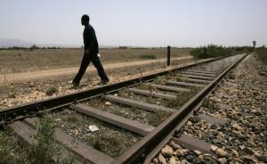 A would-be immigrant walks at the border between Morocco