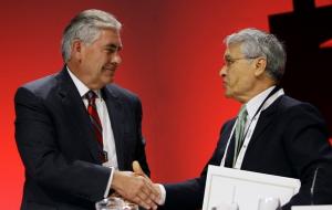 Rex Tillerson (L), chairman and chief executive officer of