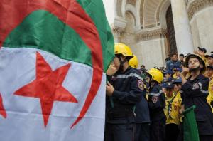 Algerian scout children participate in a national independence rally
