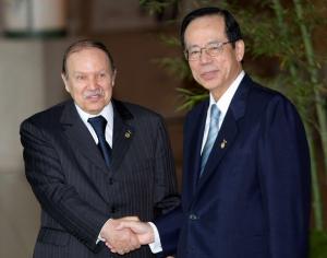 Algeria President Abdelaziz Bouteflika shakes hand with Japanese Prime