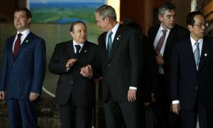 U.S. President George W. Bush (C) speaks with Algeria