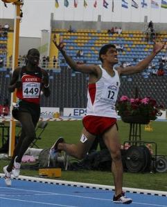 Imad Touil ,12, from Algeria celebrate after finishing first