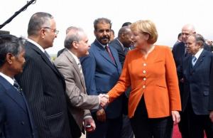 Algerian President Abdelaziz Bouteflika (R) and German Chancellor Angela