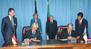 German architect Jurgen Engel (2ndL) signs the agreement on