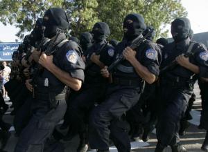 Newly graduated policemen take part in a ceremony to