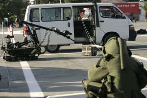 A female bomb-disposal expert takes part in an exercise