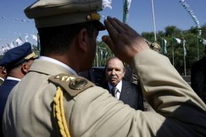 Algeria's President Abdelaziz Bouteflika is greeted by an army