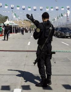 A member of the presidential security unit secures an