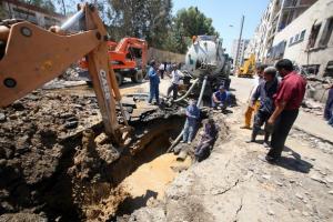 Workers operate at the site of a blast outside