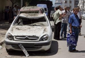 People work at the site of a blast outside