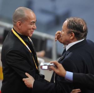 Algeria's President Abdelaziz Bouteflika speaks with Cambodian King Sihanouk