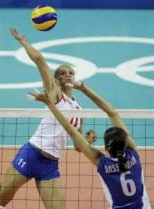 Serbia's Vesna Citakovic (L) spikes against Kazakhstan's Olga Nassedkina