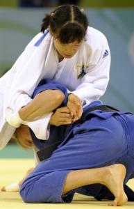 Germany's Michaela Baschin (down) and Algeria's Meriem Moussa compete