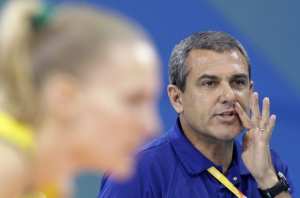 Brazil's coach Jose Roberto Guimaraes (R) talks with his