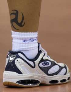 Fabiana de Oliveira of Brazil shows her tattoo during