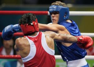 India's Kumar Dinesh (L) fights against Algeria's Abdelhafid Benchabla