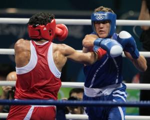 India's Kumar Dinesh (L) fights against Algeria's Abdelhafid Benchabla