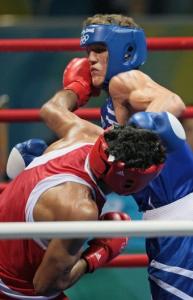 India's Kumar Dinesh (L) fights against Algeria's Abdelhafid Benchabla