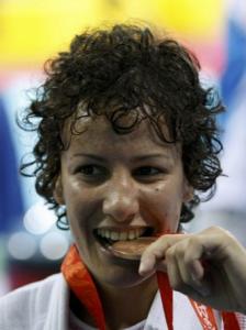 Soraya Haddad of Algeria bites her medal after winning