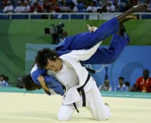 Soraya Haddad of Algeria (white) fights with Hortance Diedhiou