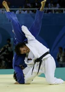 Soraya Haddad of Algeria (white) fights with Kim Kyungok