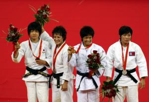 Judo medallist (L-R) An Kum Ae of North Korea