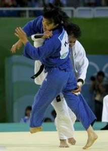 Soraya Haddad of Algeria (white) fights with Sholpan Kaliyeva