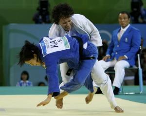Soraya Haddad of Algeria (white) fights with Sholpan Kaliyeva