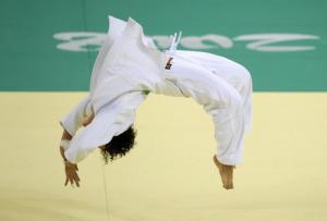 Algeria's Soraya Hadad celebrates winning Kazakhstan's Sholpan Kaliyeva during