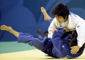 Japan Misato Nakamura (R) and South Korea Kyungok Kim