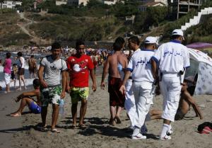 Policemen patrol on the Tigzirt beach August 4, 2008.