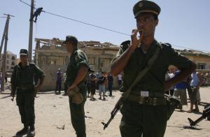 Gendarmes stand guard at the site of a suicide