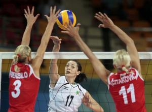 Lydia Oulmou (C) of Algeria plays a shot as