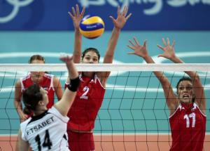 Faiza Tsabet (L) of Algeria plays a shot as