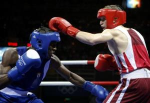 Hamza Kramou (R) of Algeria fights Yordenis Ugas Hernandez