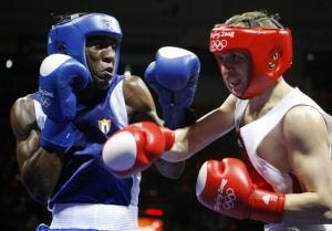 Hamza Kramou (R) of Algeria fights Yordenis Ugas Hernandez