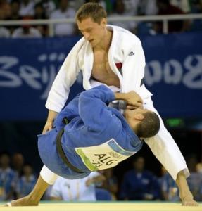 Algeria's Amar Meridja and Belarus Konstantin Semenov (top) compete