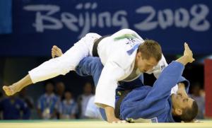Algeria's Amar Meridja (R) and Belarus Konstantin Semenov compete