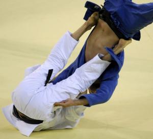 Algeria's Amar Meridja (R) and Belarus Konstantin Semenov compete