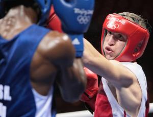 Cuba's Yordenis Ugas (R) fights against Algeria's Hamza Kramou