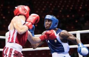Cuba's Yordenis Ugas (R) fights against Algeria's Hamza Kramou