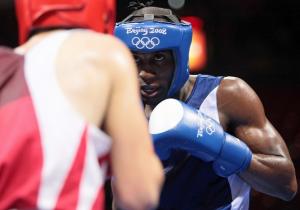 Cuba's Yordenis Ugas (R) fights against Algeria's Hamza Kramou