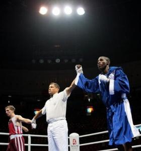 Cuba's Yordenis Ugas ( R) is declared winner after