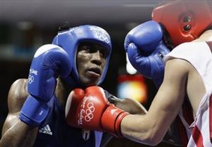 Hamza Kramou of Algeria, right, fights Yordenis Ugas of