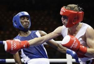 Hamza Kramou of Algeria, right, hits Yordenis Ugas of